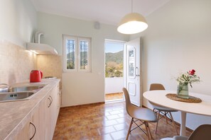 Apartment, 1 Bedroom | Private kitchen | Full-sized fridge, stovetop, coffee/tea maker, electric kettle - Marina Beachfront Apartment by Konnect, Ipsos Corfu (Corfu)