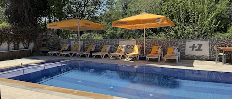 Outdoor pool, pool umbrellas, sun loungers