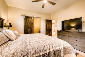 A bedroom with a bed, a dresser, a TV, and a ceiling fan. - GUEST FAVORITE! Blue River Retreat- Modern Mountain Home! Pet Friendly, Spa! (Breckenridge)