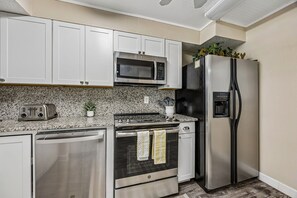 Coffee/tea maker, fridge, microwave, oven