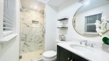 Bathtub, hair dryer, towels, soap