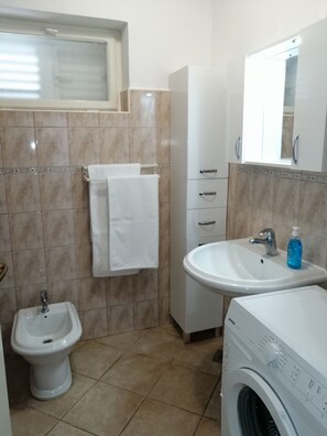 Bathtub, hair dryer, towels