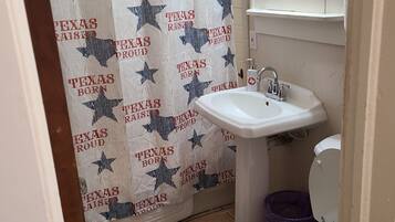 Combined shower/tub, hair dryer, towels, soap