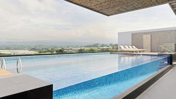 Outdoor pool, open 8:00 AM to 9:00 PM, sun loungers