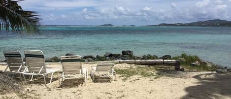 On the beach, sun loungers, beach towels
