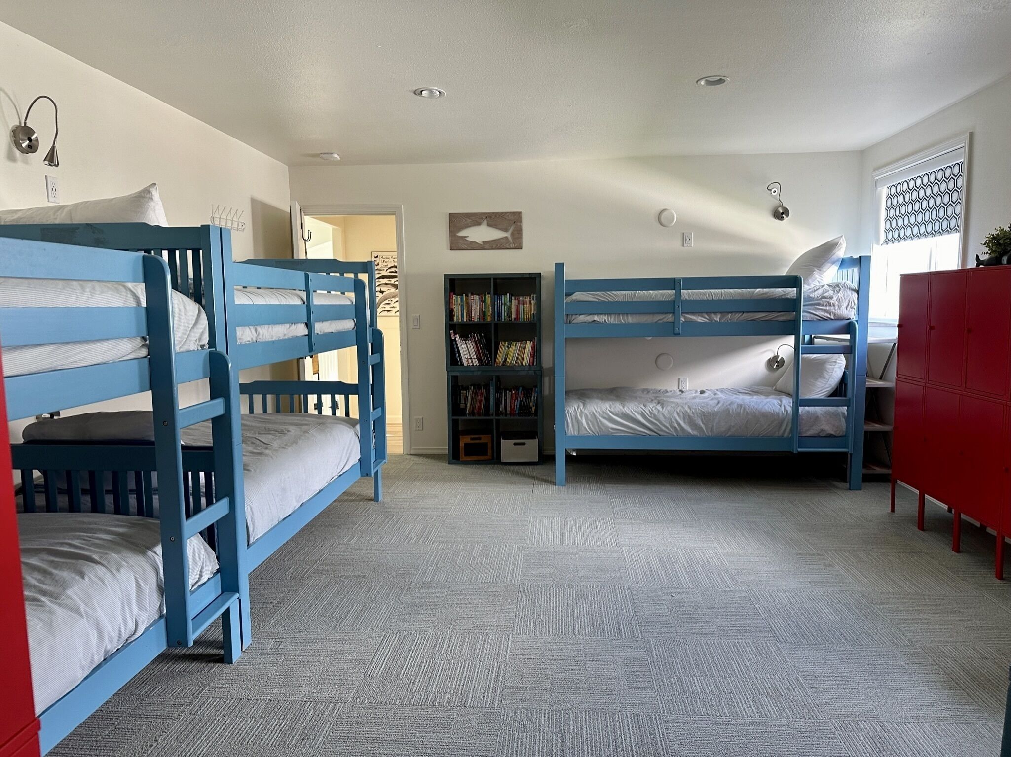 Three bunk beds and a futon in the big bunk room.
