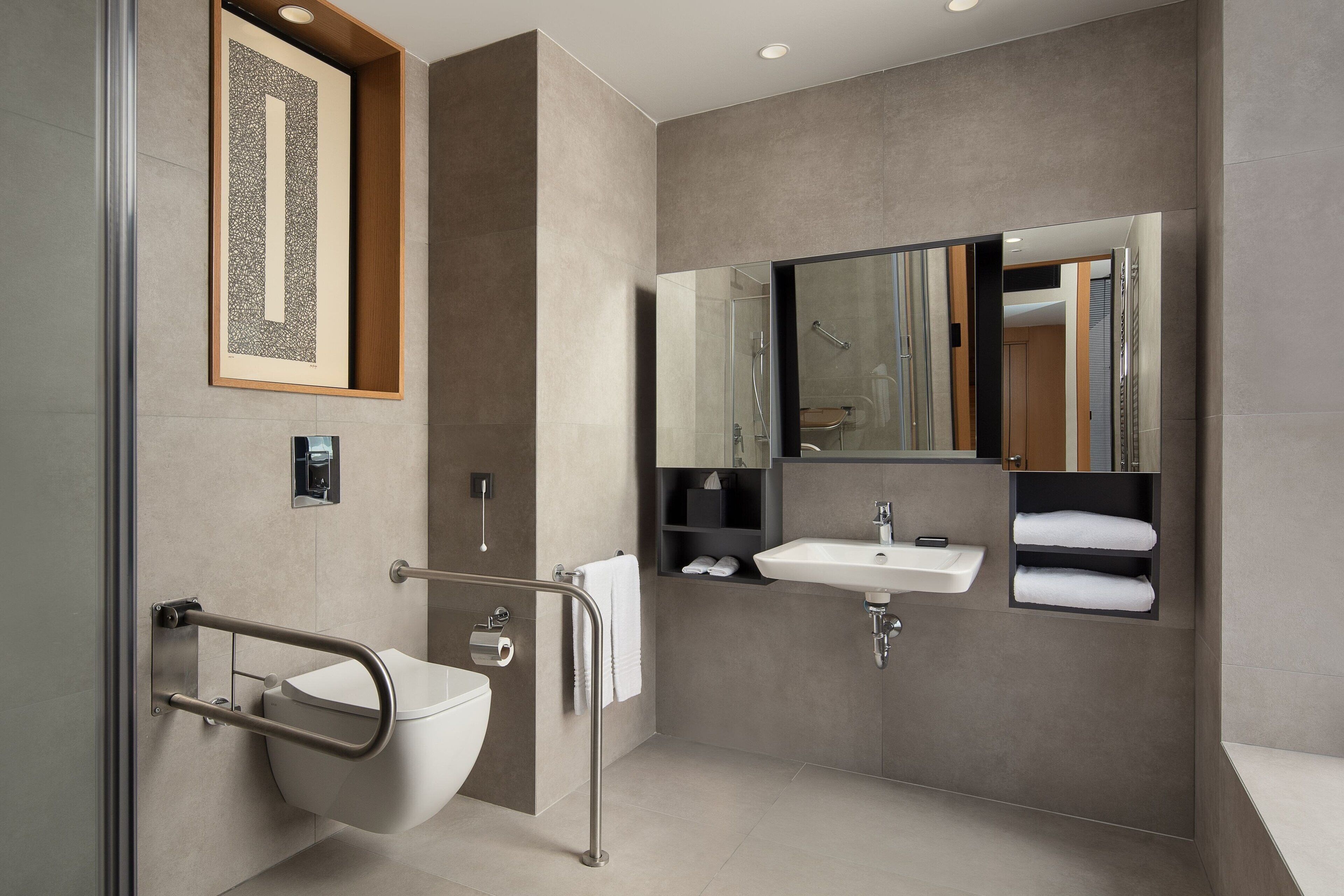 premium room, 1 king bed, city view, corner | bathroom | shower, hair dryer, slippers, towels