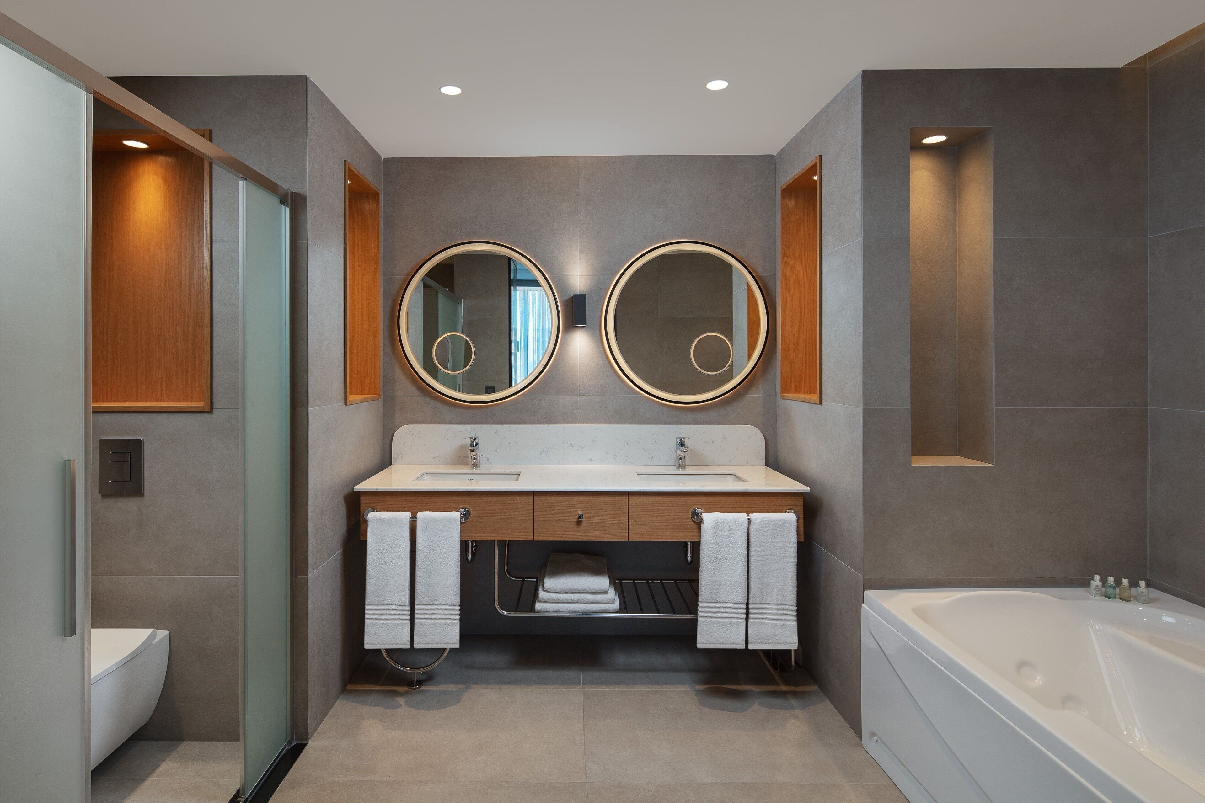 shower, hair dryer, slippers, towels