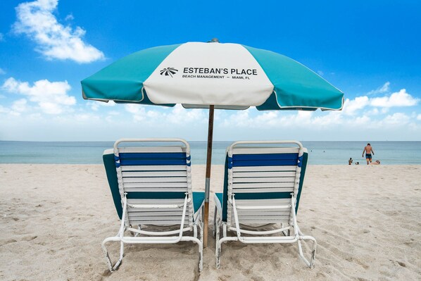 On the beach, sun-loungers, beach towels