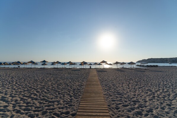 On the beach, sun loungers, beach umbrellas, beach towels