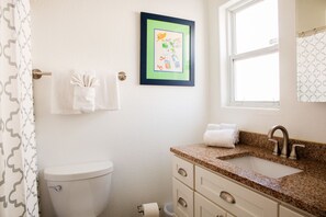 Bathtub, hair dryer, towels, soap