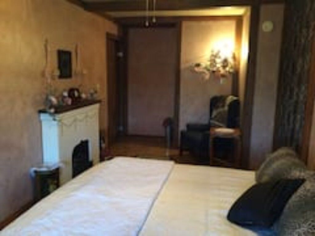 Private French-themed room with shared baths kitchenette