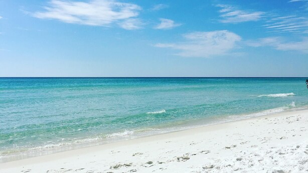 A beach with clear turquoise water and white sand. - Grand Sandestin by Baytowne Wharf Village at Sandestin Golf & Beach Resort.   (Miramar Beach)