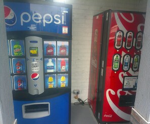 Two vending machines, one for Pepsi and one for Coca-Cola, with various drink options. - Red Roof Inn Richmond - Airport/ Sandston (Sandston)