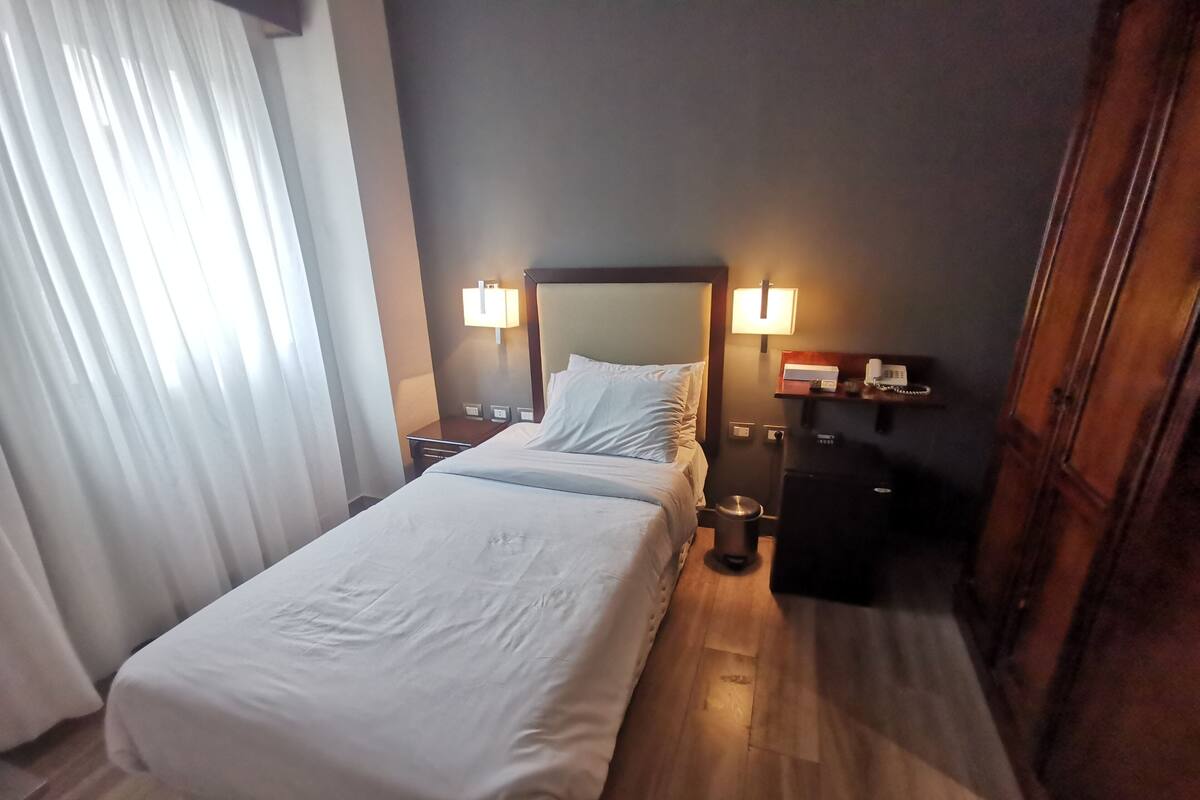 Egyptian cotton sheets, premium bedding, minibar, blackout drapes