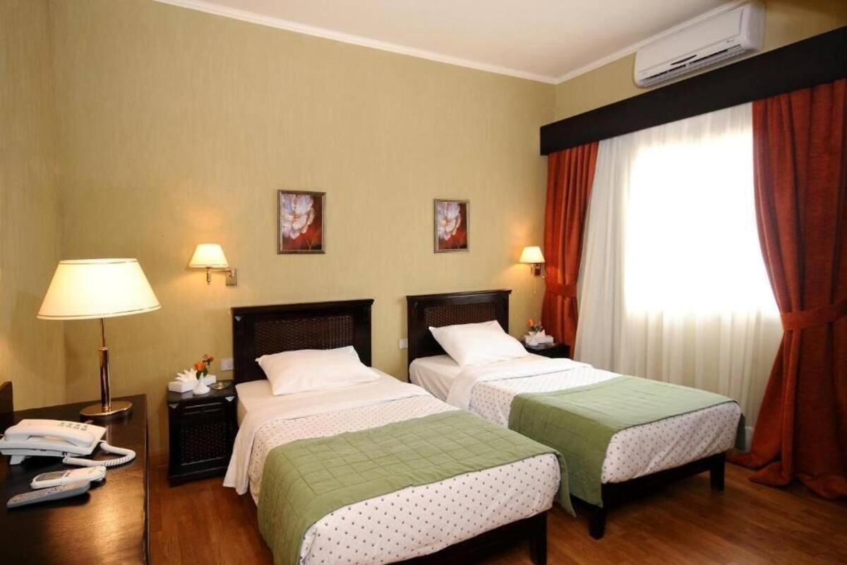 Egyptian cotton sheets, premium bedding, minibar, blackout drapes