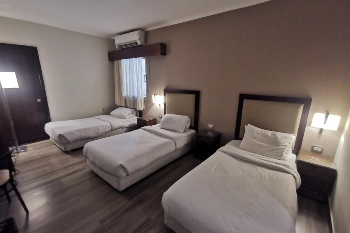 Egyptian cotton sheets, premium bedding, minibar, blackout drapes