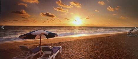 On the beach, sun loungers, beach towels