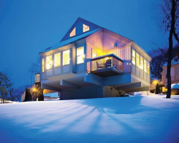 Enjoy the expansive views from the upper-floor balcony overlooking the snow-covered landscape.