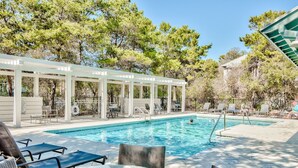 A pool area with lounge chairs and a covered seating area. - 30A Beach Bungalow in Inlet: Steps from Sea, Pool with Golf Cart & Cruiser Bikes (Seacrest)