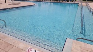 A clear swimming pool with a 'NO DIVING' sign, a 3 FT 6 IN depth marker, and a tiled deck with lounge chairs. - Cozy 55+ Punta Gorda Home - Pet Friendly, Fully Furnished! Pool/Lake/Club (Punta gorda)