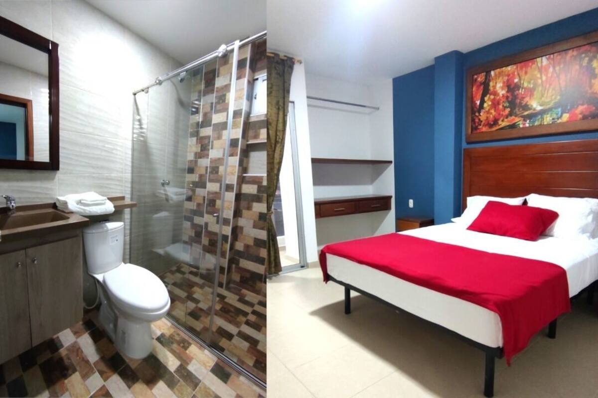 A bathroom with a shower, toilet, and sink.