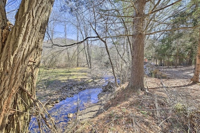 Quaint Creekside Home w/ Spacious Deck & Yard