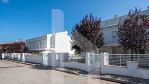 A residential street with white buildings, a clear blue sky, and a paved road. - The recently-built Résidence Cerrano Park comprises two buildings with 12 three-room apartments, and offers guests the unique opportunity to enjoy breakfast or lunch with a breathtaking view of the surrounding countryside. (Foggetta)