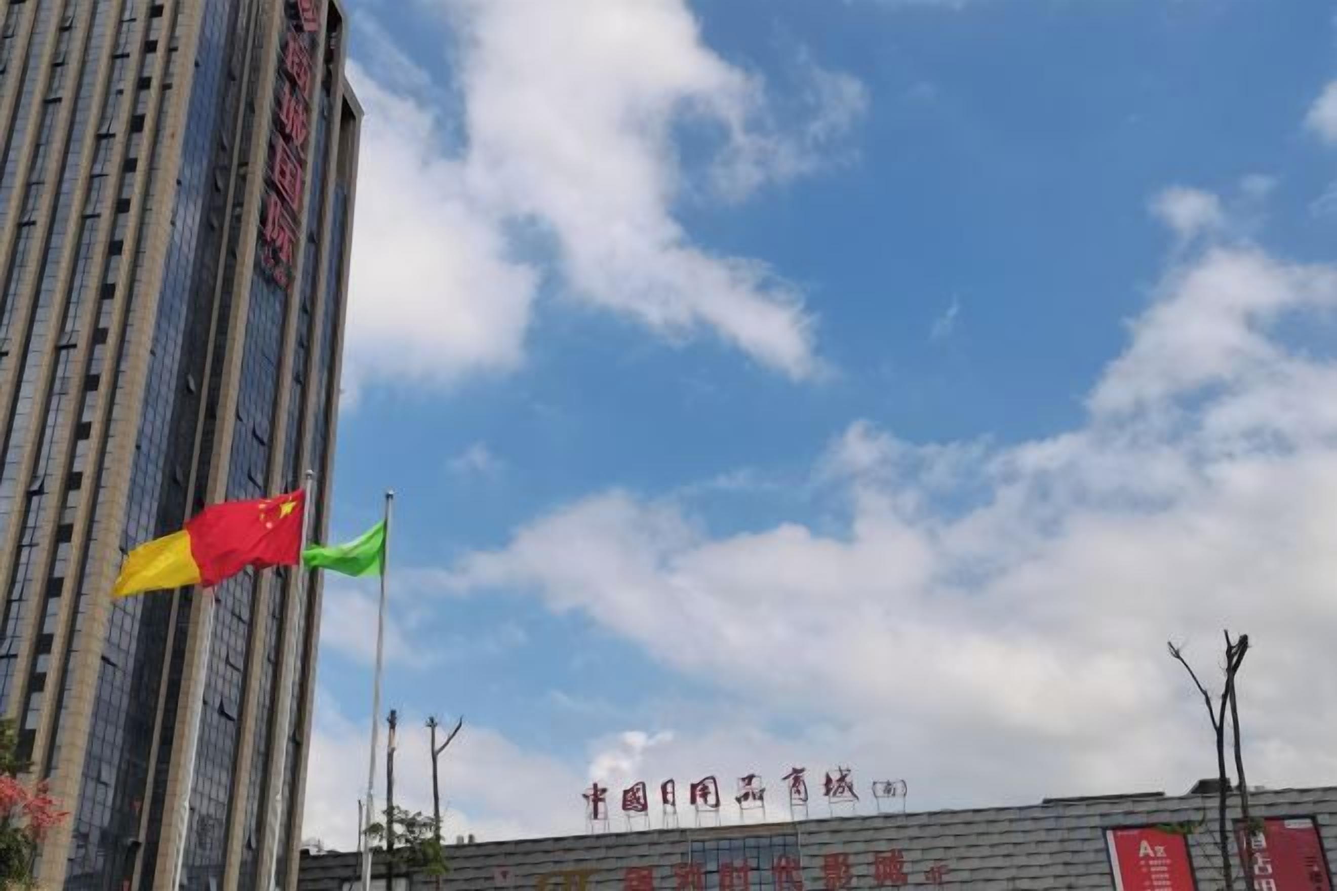 A building with a clear sky and flags.