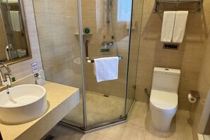 A bathroom with a glass-enclosed shower, a sink, and a toilet. - Vienna Hotel (Taizhou Luqiao Passenger Center) (Taizhou)