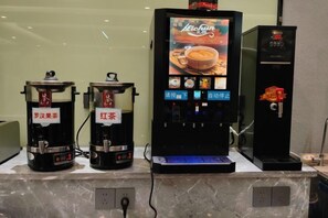 A coffee machine with a digital display and a separate espresso machine. - Jinbiwan Hostel (Kaiping)