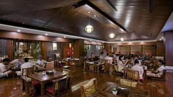 A traditional-style restaurant with wooden furniture and a warm ambiance.