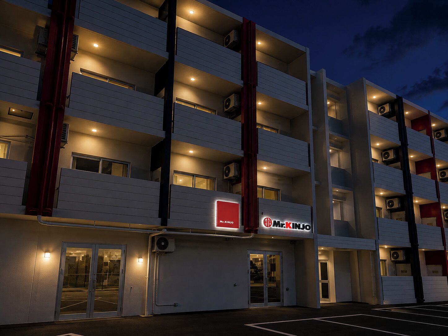 A multi-story hotel with a modern design, featuring balconies on each floor and a prominent signage.