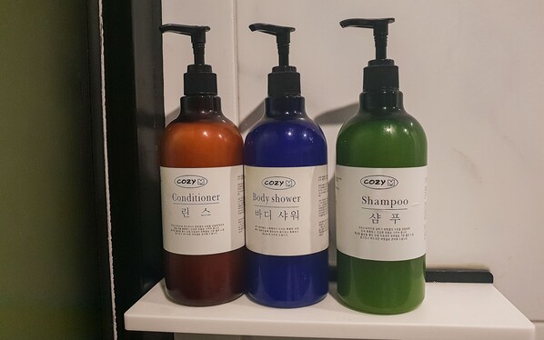 Three bottles of personal care products on a shelf. - Jinju Chungmugongdong Cozy (Jinju)