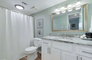 Combined shower/bathtub, hair dryer, towels, soap