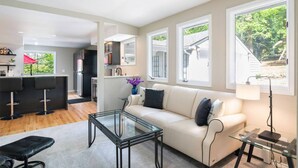 Living area - Renovated 4BR retreat near Seattle with patio, sport court, foosball room & lake views for families (Lake Forest Park)