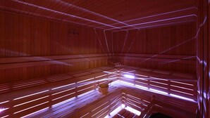 A sauna with wooden benches and a bucket. - Happy Inn Gebze Hotel (Gebze)