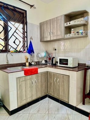 Fridge, microwave, stovetop, coffee/tea maker