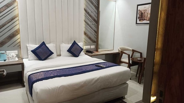 Chambre Deluxe double | Lit d’appoint (supplément), accès au Wi-Fi (inclus), literie fournie