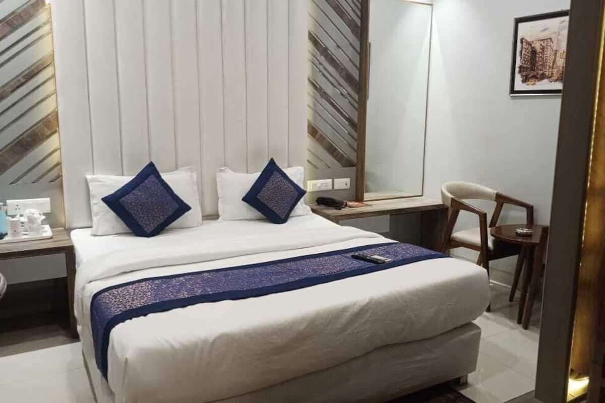 Habitación doble Deluxe | Camas extra, wifi gratis y ropa de cama