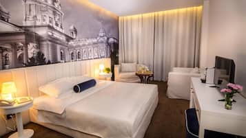 Premium bedding, memory-foam beds, desk, laptop workspace