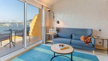 Suite, River View | Living area | 49-inch LCD TV with cable channels, TV