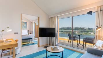 Suite, River View | Living area | 49-inch LCD TV with cable channels, TV