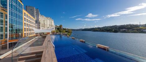 Indoor pool, outdoor pool, pool umbrellas, pool loungers