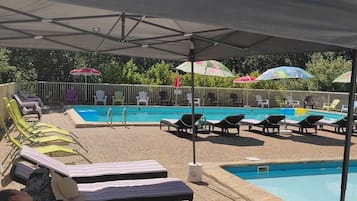 Seasonal outdoor pool, open 11:30 AM to 8:30 PM, pool umbrellas