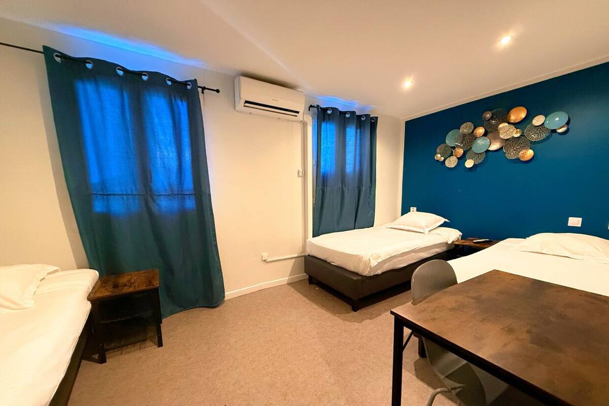 Family Triple Room | Desk, laptop workspace, blackout drapes, iron/ironing board (on request)