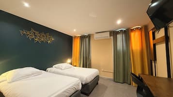 Standard Twin Room | Desk, laptop workspace, blackout drapes, iron/ironing board