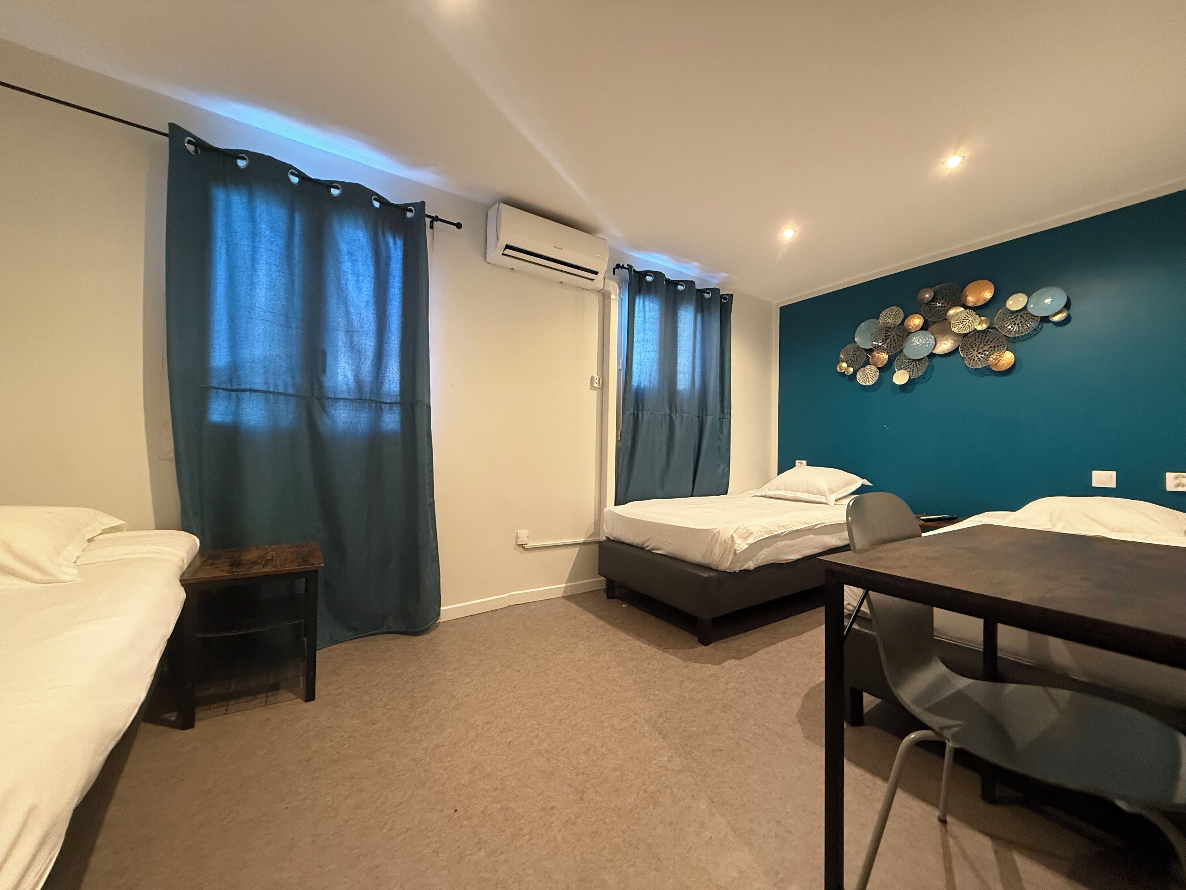 Standard Triple Room | Desk, laptop workspace, blackout curtains, iron/ironing board