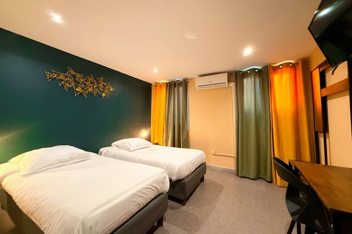 Standard Twin Room | Desk, laptop workspace, blackout drapes, iron/ironing board (on request)