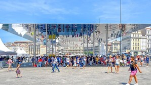 A bustling public square with a large reflective glass structure in the center, surrounded by historic buildings and a crowd of people. - Hotel Le Beausejour (Marseille)
